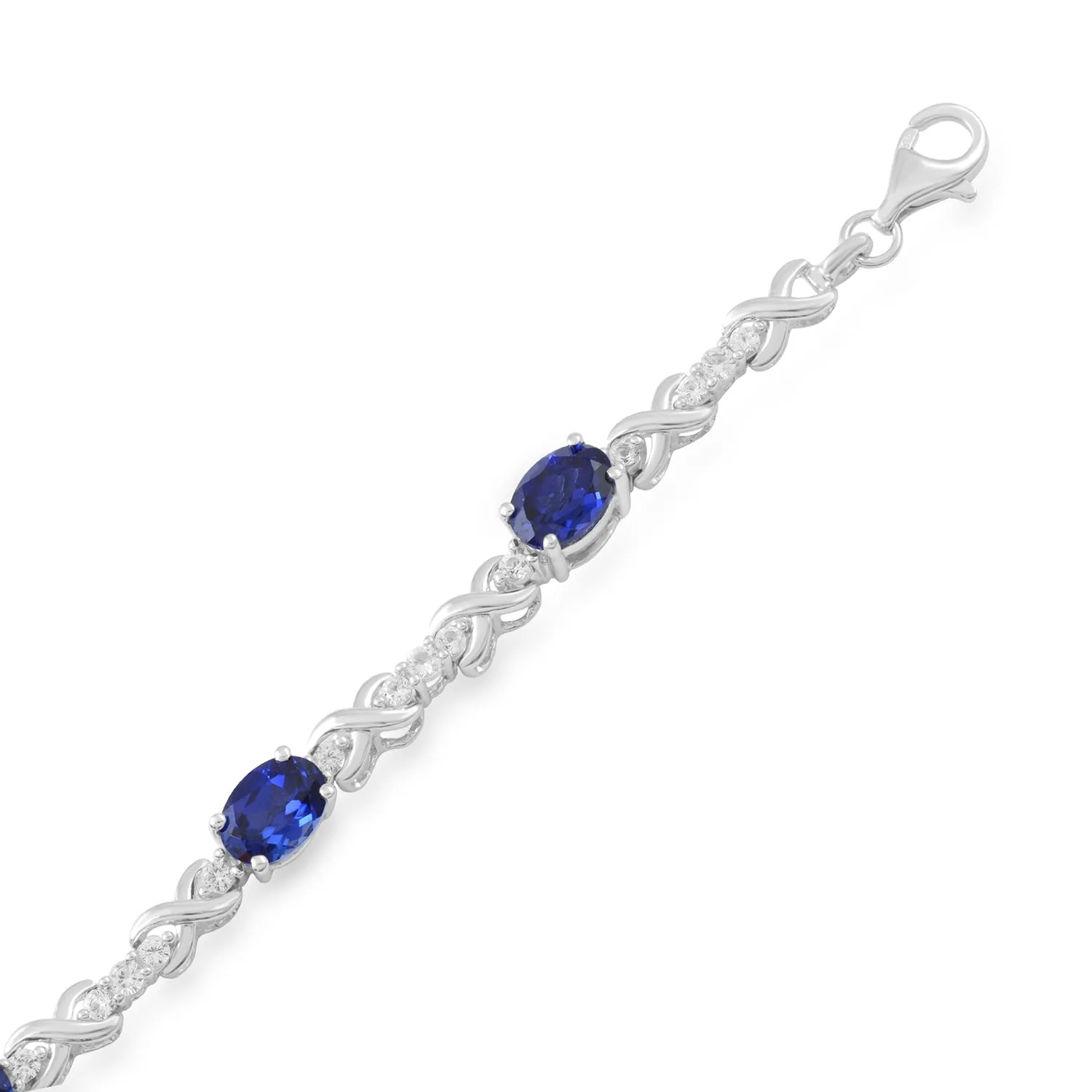 Jewelili Sterling Silver 7x5 mm Oval Shape Created Blue Sapphire and Created White Sapphire Bracelet