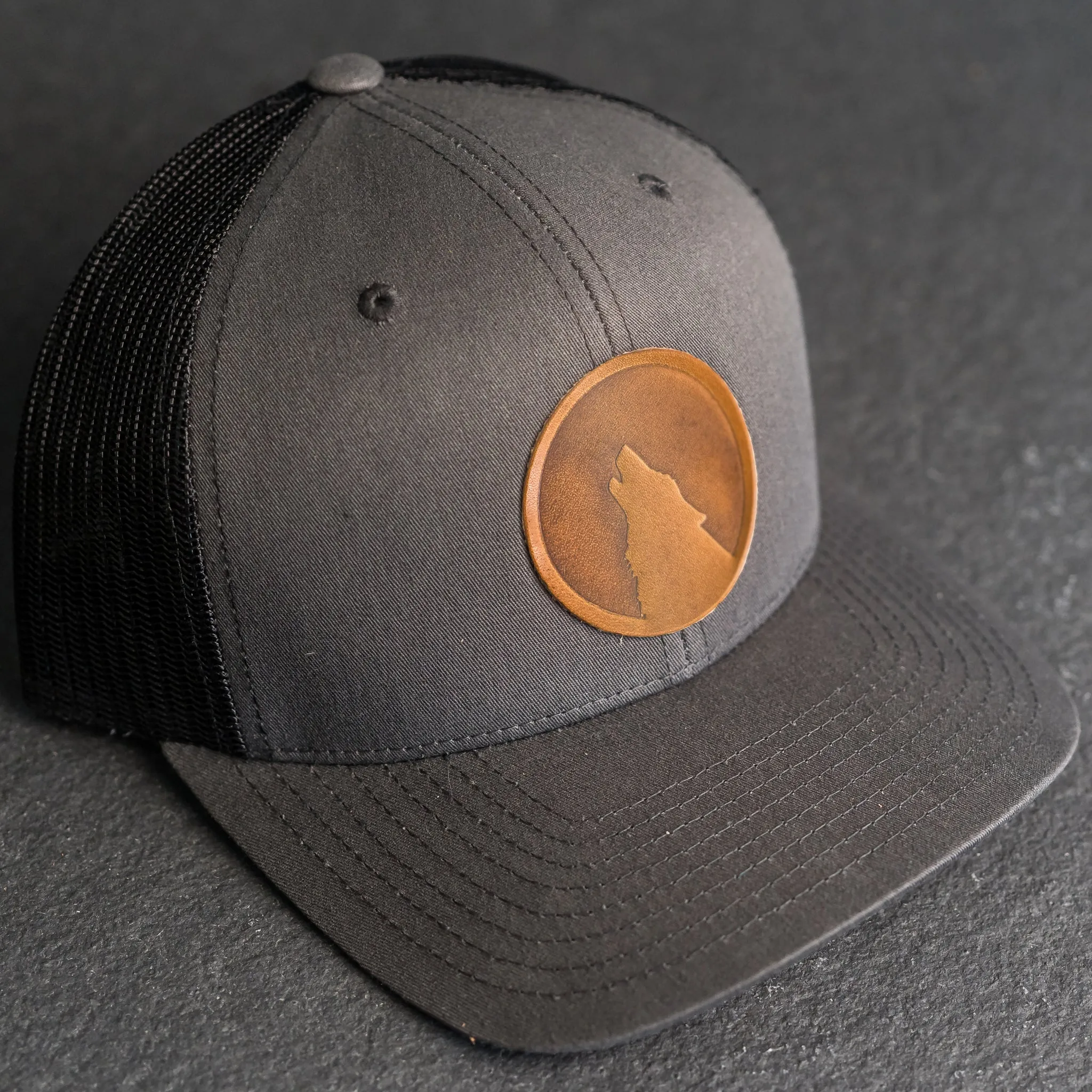 Leather Patch Trucker Style Hat - Wolf Stamp