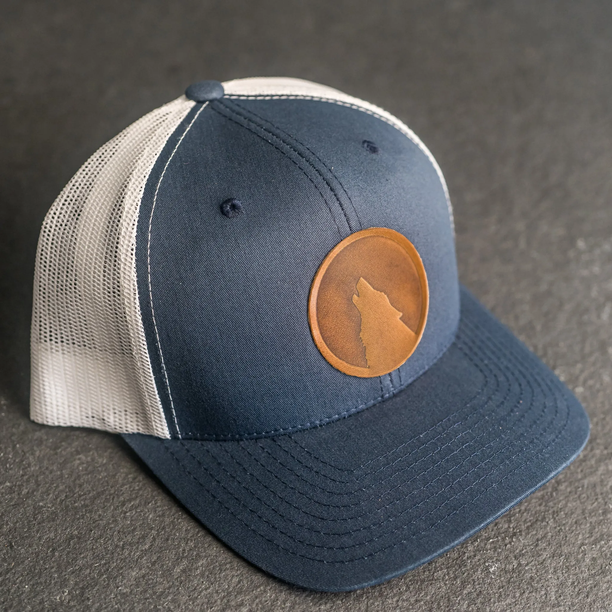 Leather Patch Trucker Style Hat - Wolf Stamp